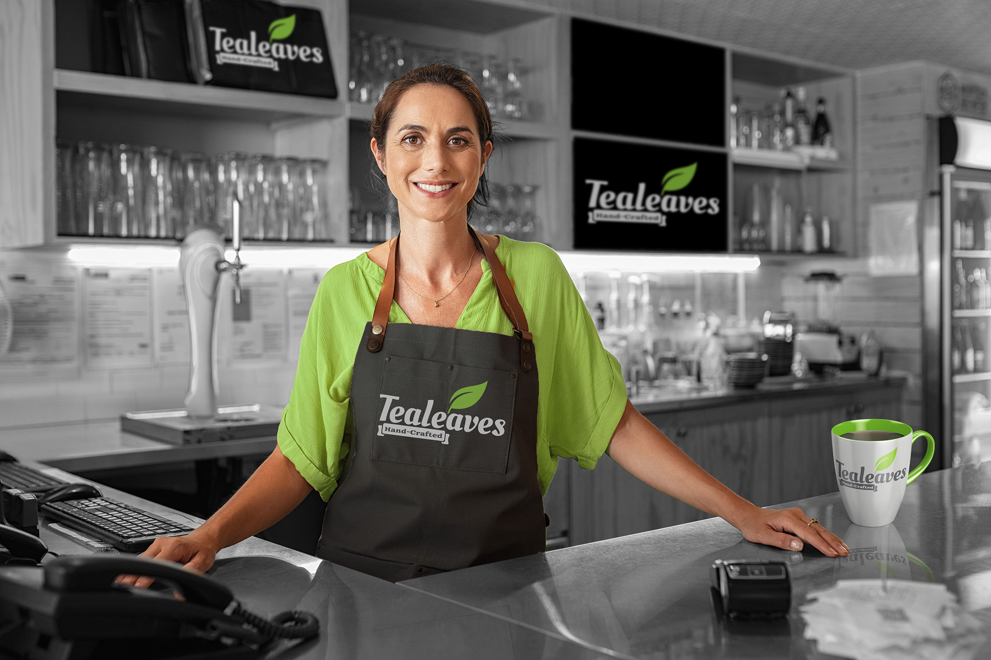 Tealeaves cafe branding on apron and mug